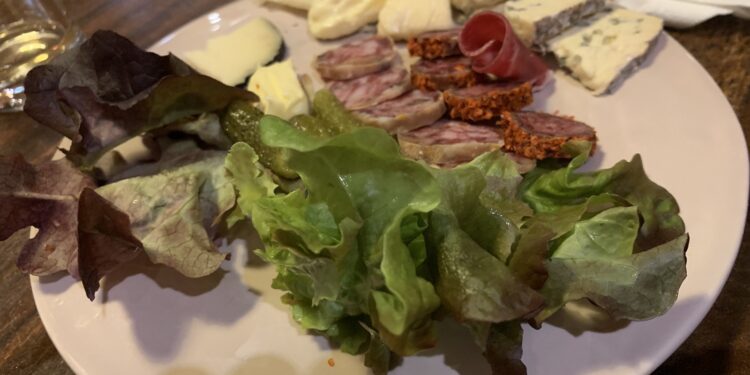 Charcuterie board with prosciutto speck bresaola and salami for raclette — charcuterie for raclette
