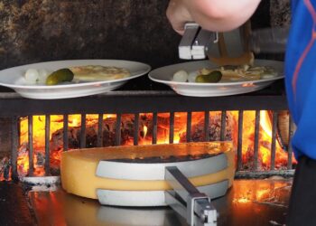 Quick express raclette recipe ready in 30 minutes for four — melted cheese over baby potatoes