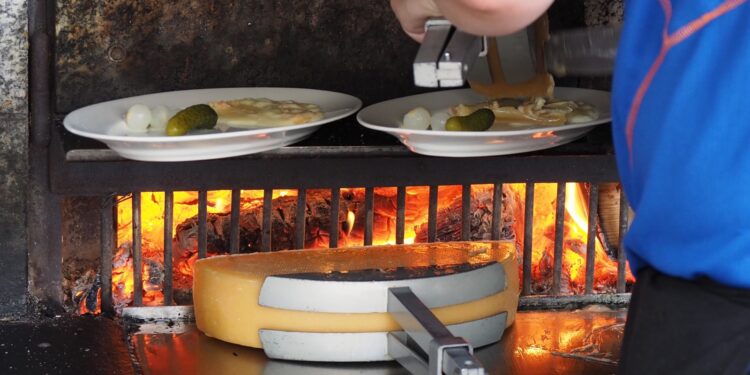 Quick express raclette recipe ready in 30 minutes for four — melted cheese over baby potatoes