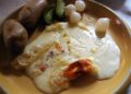 how much raclette cheese per person — melted portions served at a convivial table