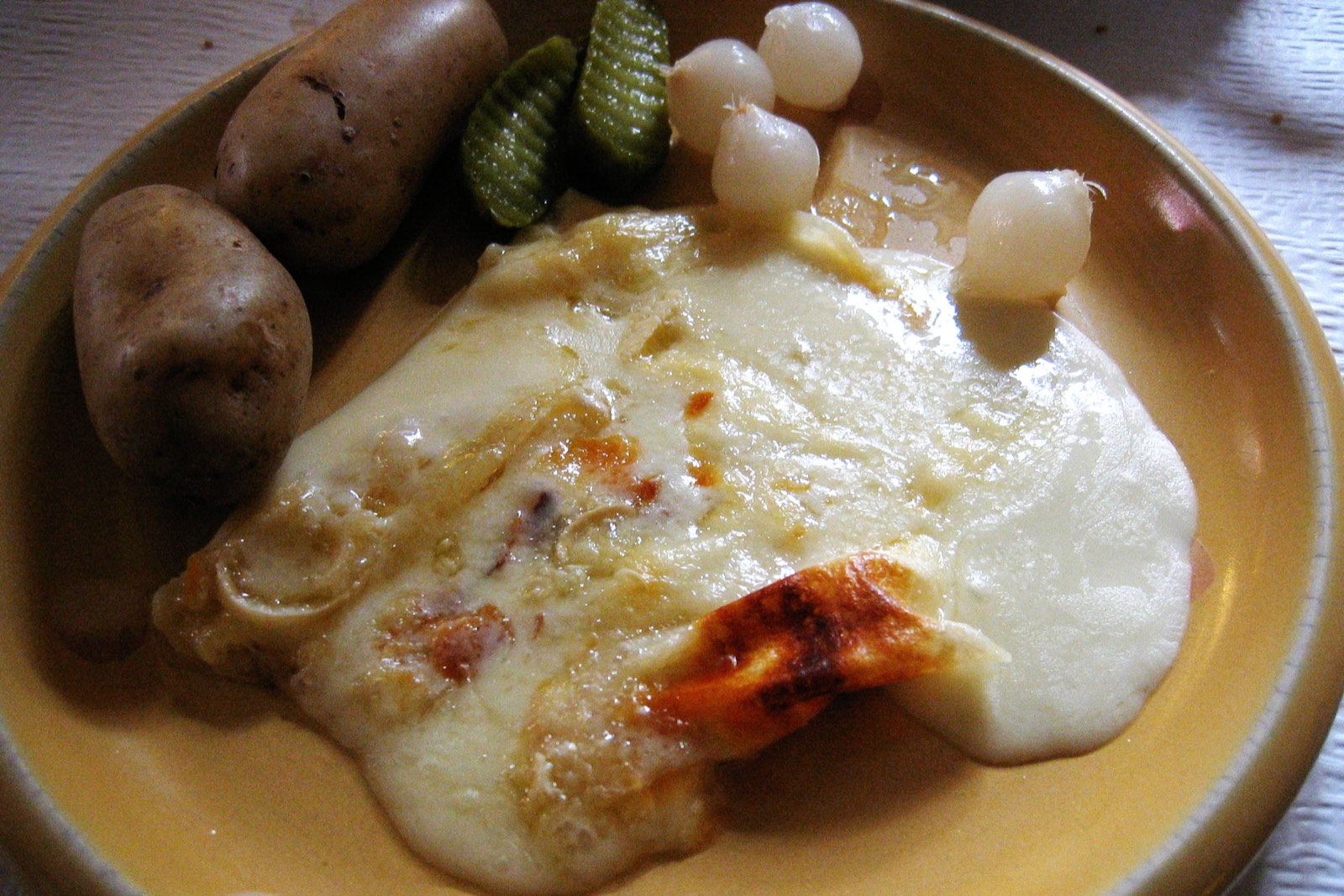 raclette with potatoes Zermatt Switzerland — traditional alpine raclette method