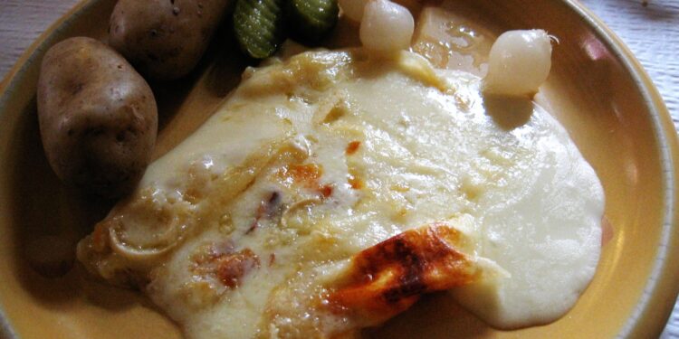 vegetarian raclette recipe spread with cheese, potatoes and grilled vegetables